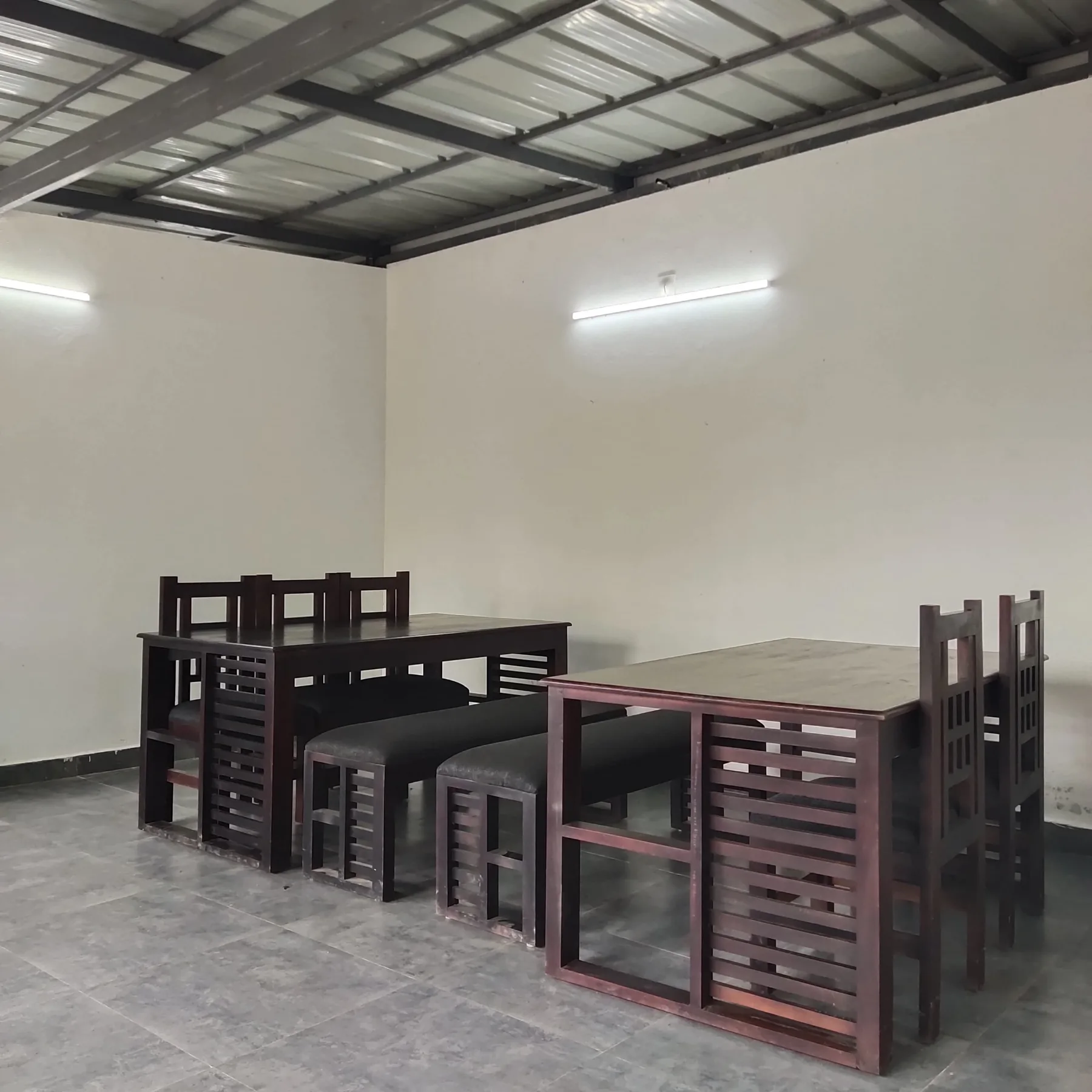 Dining area with wooden tables and benches